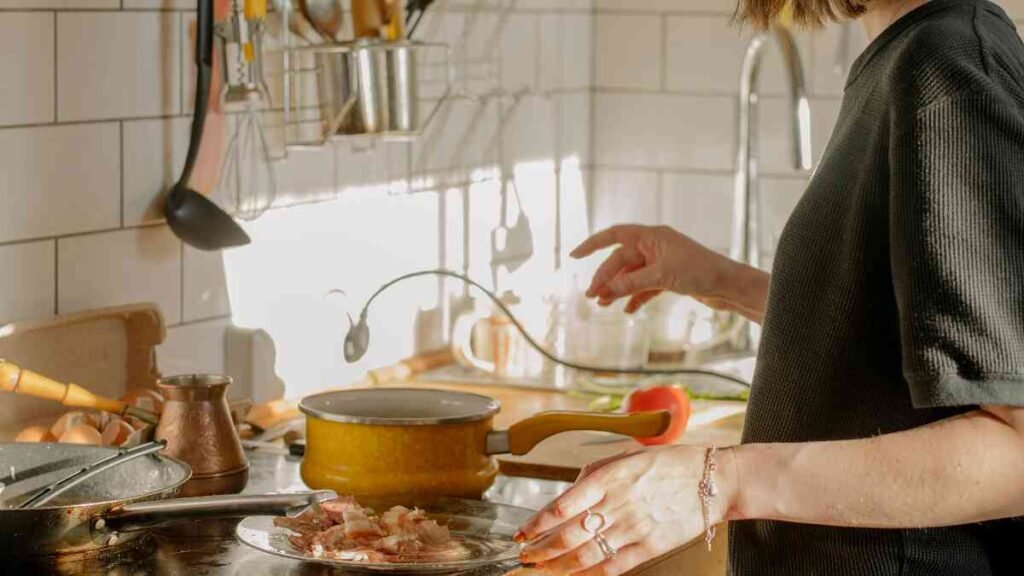 Cooking affordable meals at home instead of eating out to save money for debt