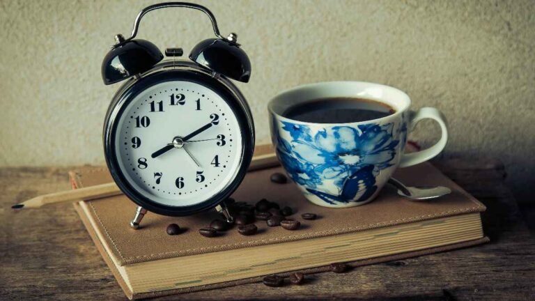 Alarm clock and coffee representing millionaire morning habits for success