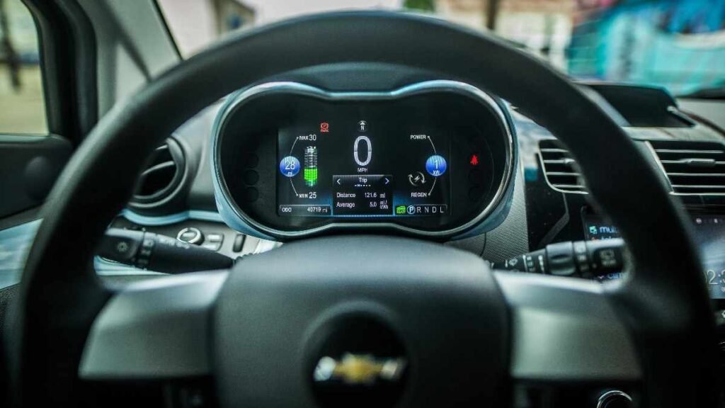 A car dashboard showing mileage, representing how to track transportation costs in a low income survival budget