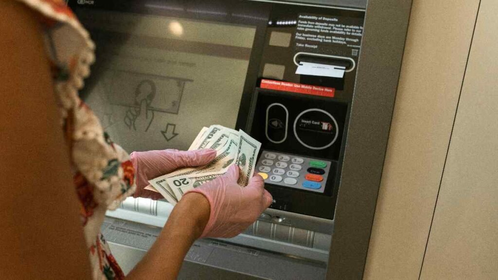 Withdrawing cash on payday to begin the cash stuffing envelope system.